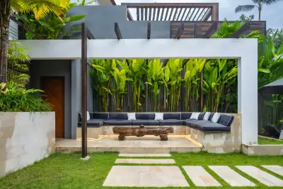 New lawn with concrete stepping pavers and outdoor furniture