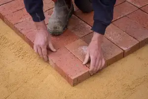 Paver being laid by hand